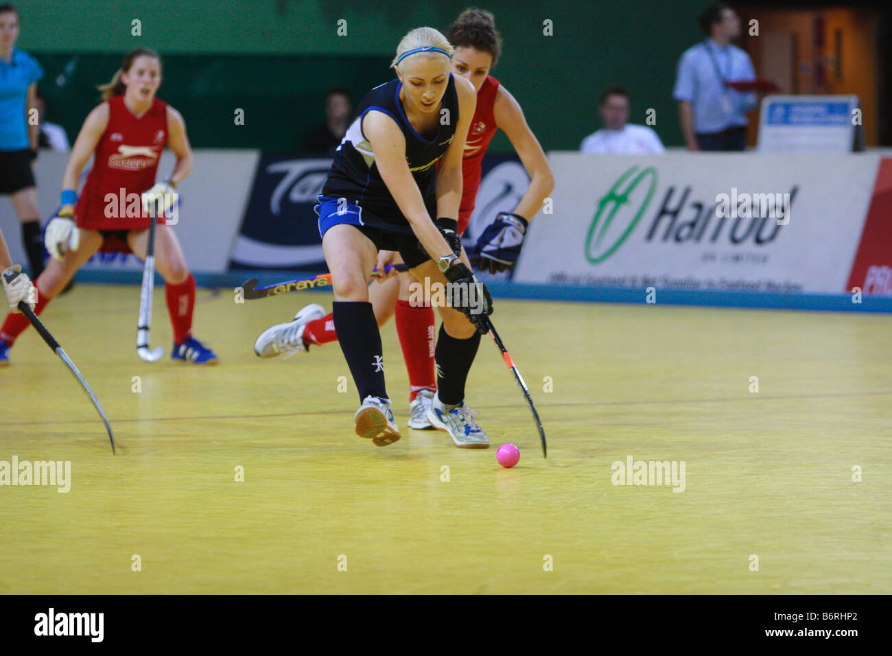 Women hockey players in Indoor competition (Scotland v England Stock
