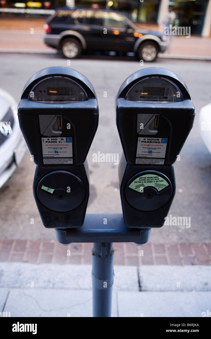 Parking meters and cars Stock Photo Alamy