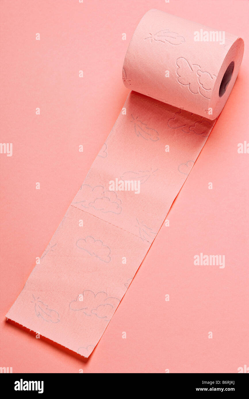 pink roll of toilette paper on pink background Stock Photo