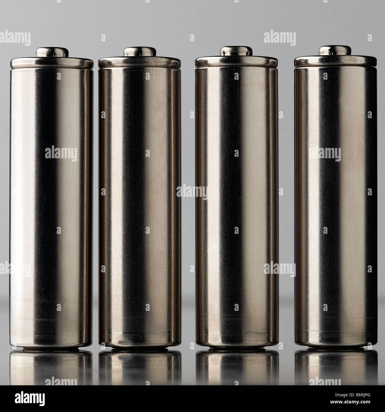four AA batteries - lineup Stock Photo - Alamy
