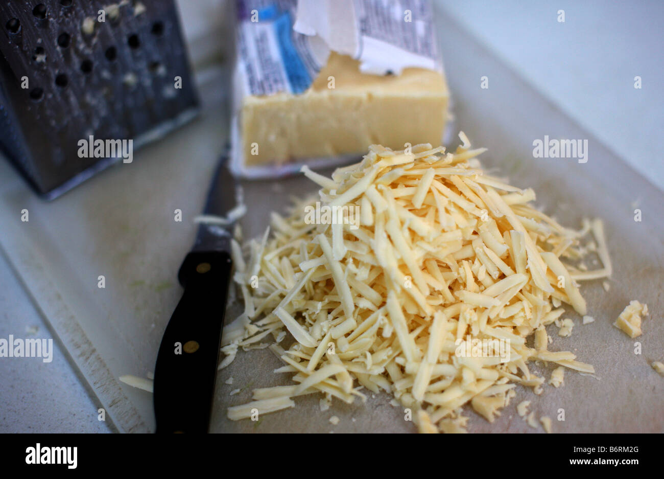 Grated cheese ready for use in recipe Stock Photo Alamy