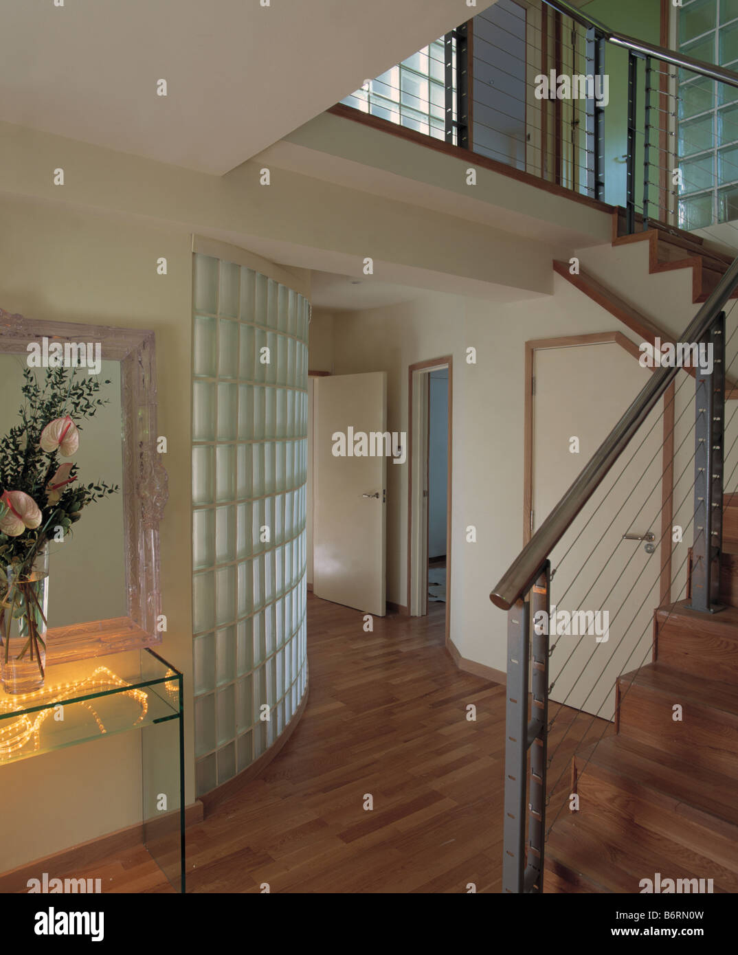 Curved Glass Brick Wall And Wooden Flooring In Modern Hall With