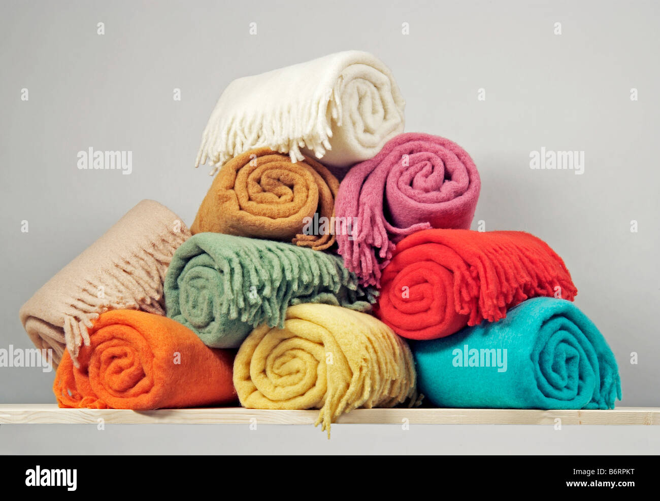 Heap of rolled up blankets Stock Photo Alamy