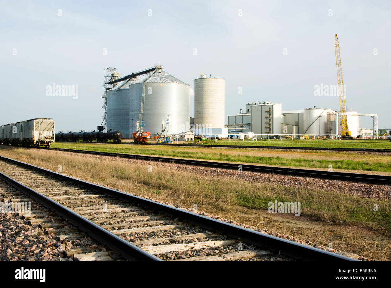 an ethanol plant in South Dakota with rail cars in the foreground Stock