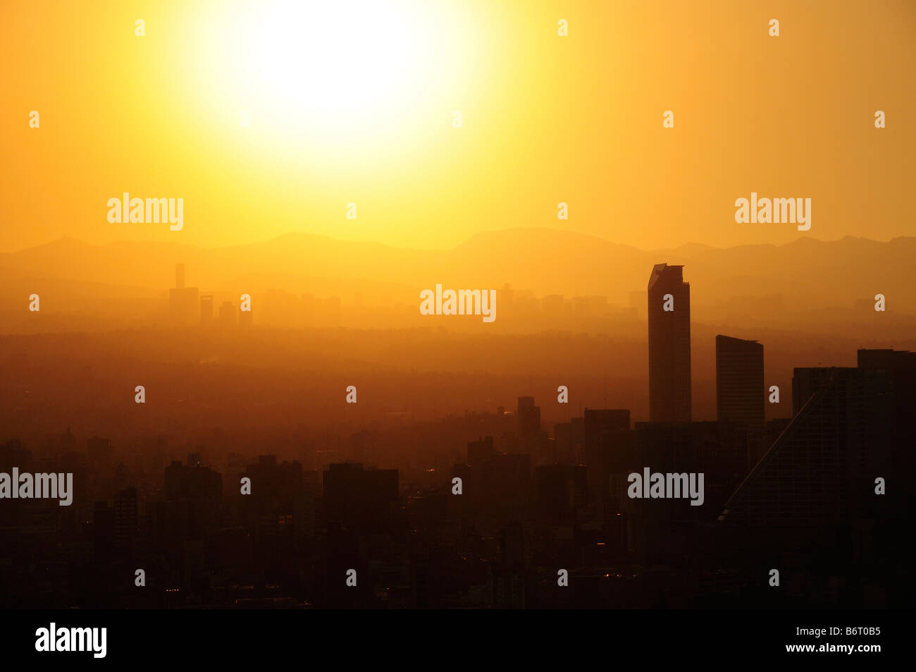 Smog at sunset, skyline of Mexico City Stock Photo