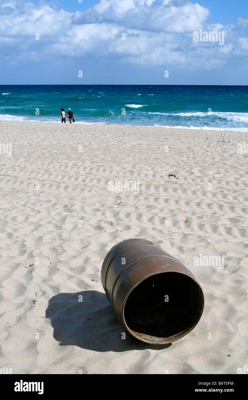 plastic garbage bin blown away by the wind on the beach in Delray Beach