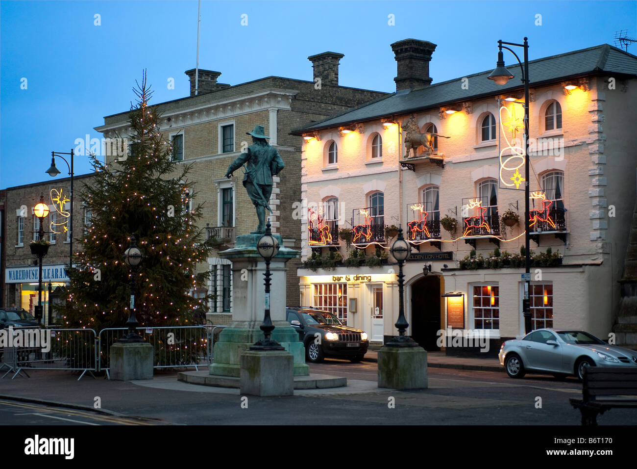 Dusk in St Ives Golden Lion Town Hall Christmas Tree and statue of Oliver Cromwell on Market Hill Stock Photo