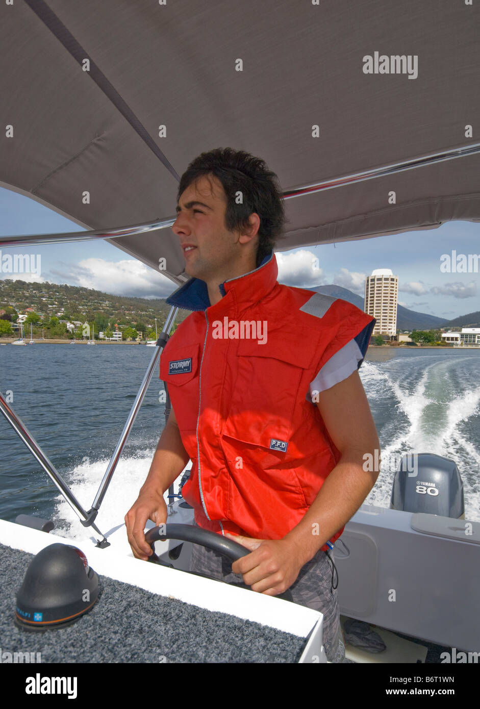 Tour boat skipper on the Derwent River in Hobart Tasmania Stock Photo