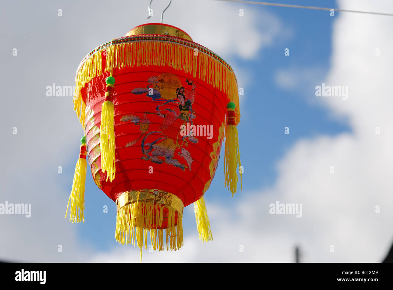 red fringed Chinese lantern against the blue sky Stock Photo - Alamy