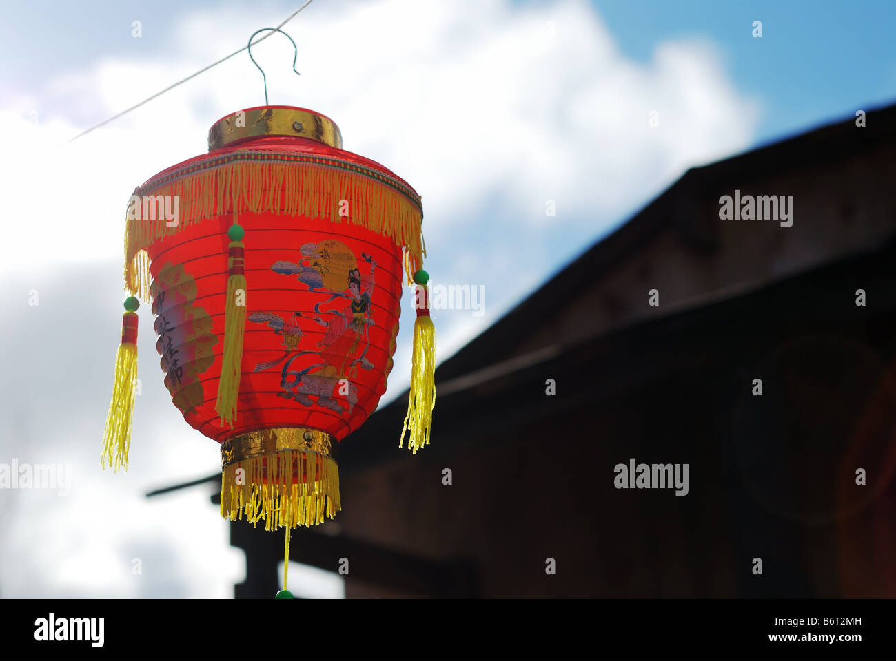 red fringed Chinese lantern against the blue sky Stock Photo - Alamy