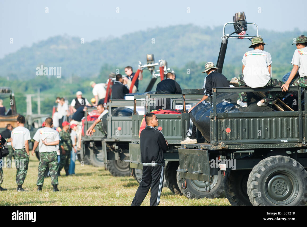 Military trucks Mercedes Benz Unimog carrying hot air balloons Stock Photo