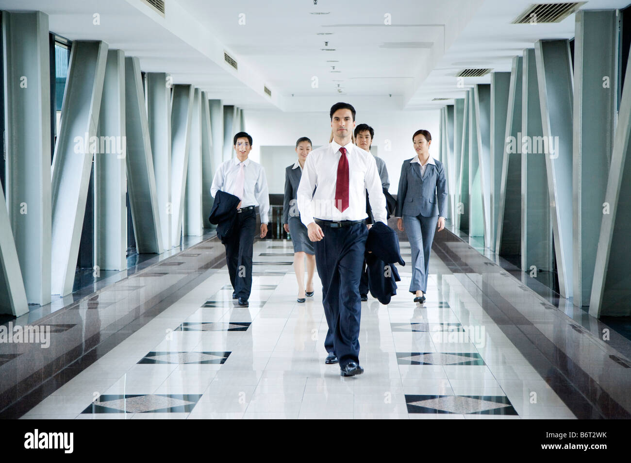 Business people walking in the office building Stock Photo