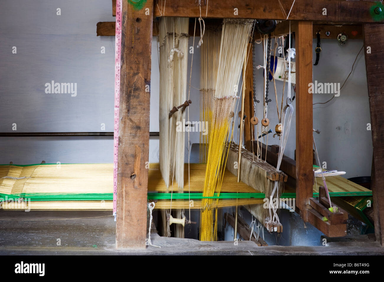 Hand loom making a silk sari in in a rural Indian village house. Andhra Pradesh, India Stock Photo