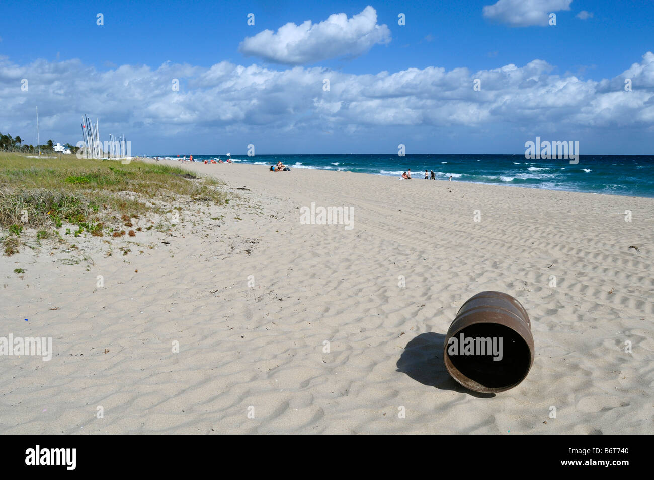 plastic garbage bin blown away by the wind on the beach in Delray beach