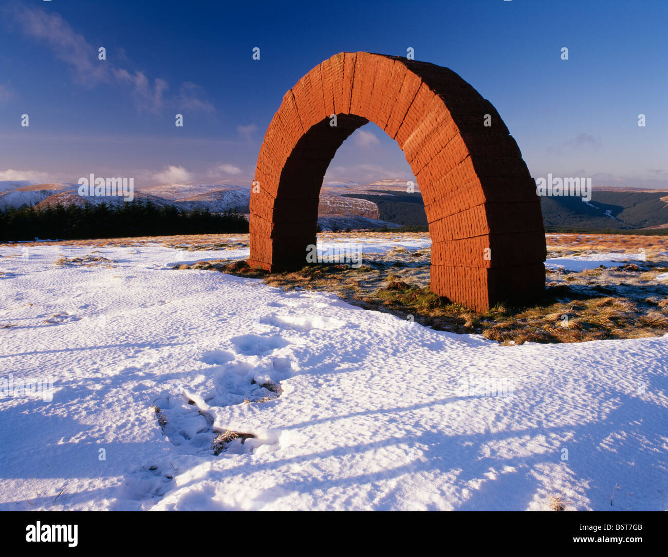 Striding Arches in landscape by enviromental artist Andy Goldsworthy an arch sculpture on Colt Hill Glenhead Scotland UK Stock Photo