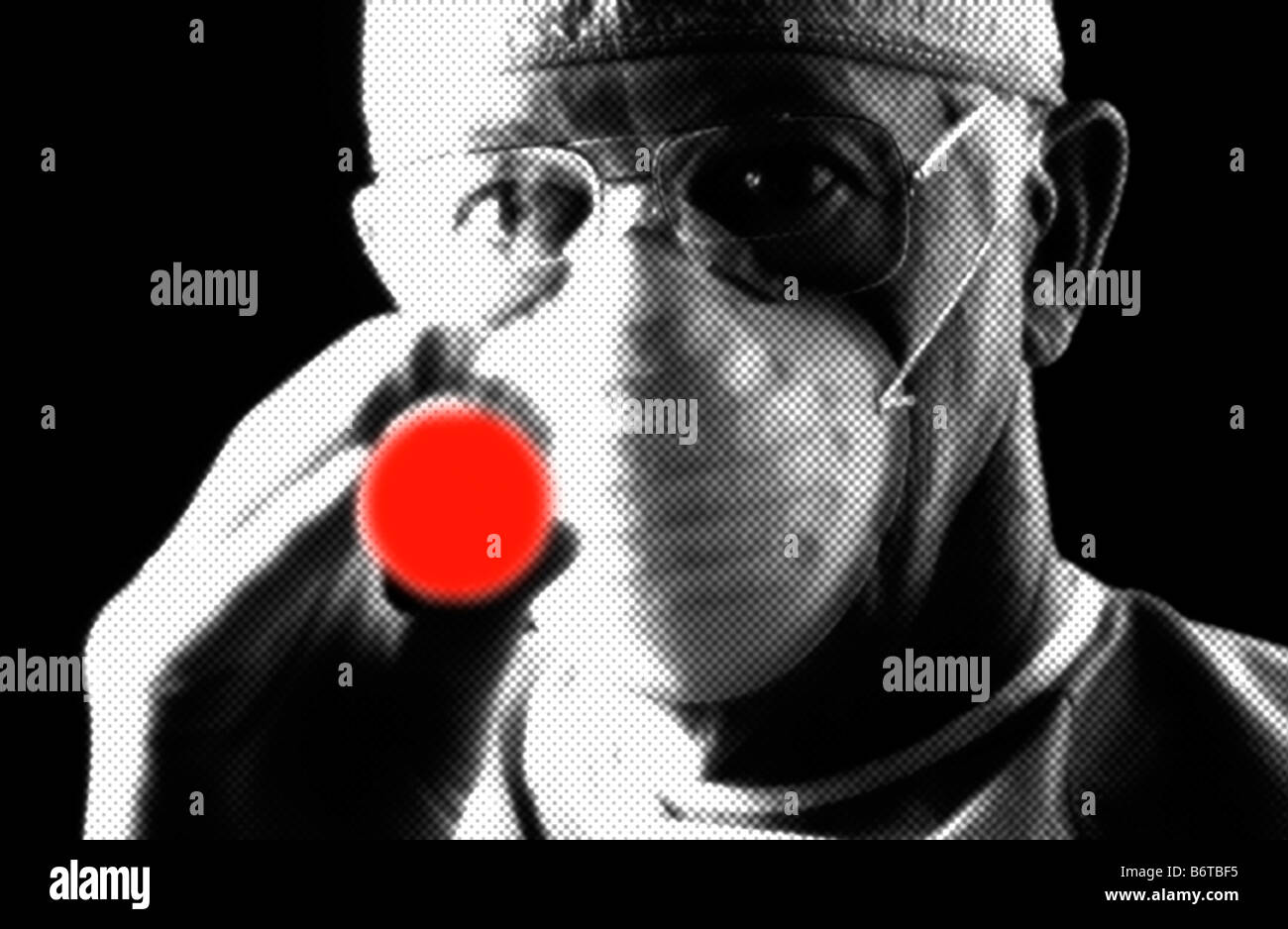 doctor examining with the aid of a red laser light digitally enhanced Stock Photo