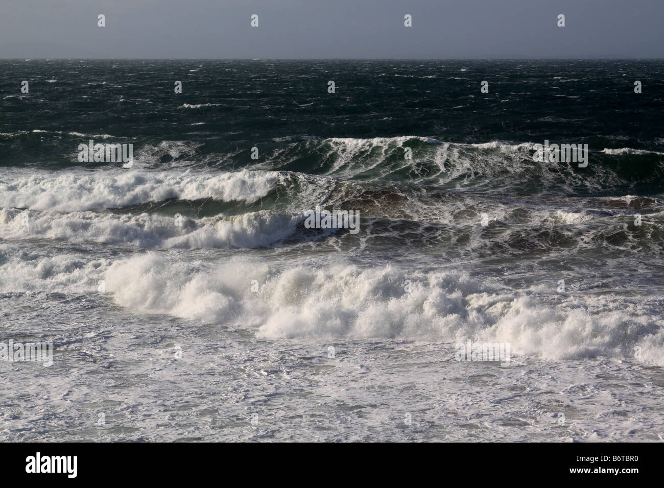 Waves breaking on rocky shore Stock Photo - Alamy