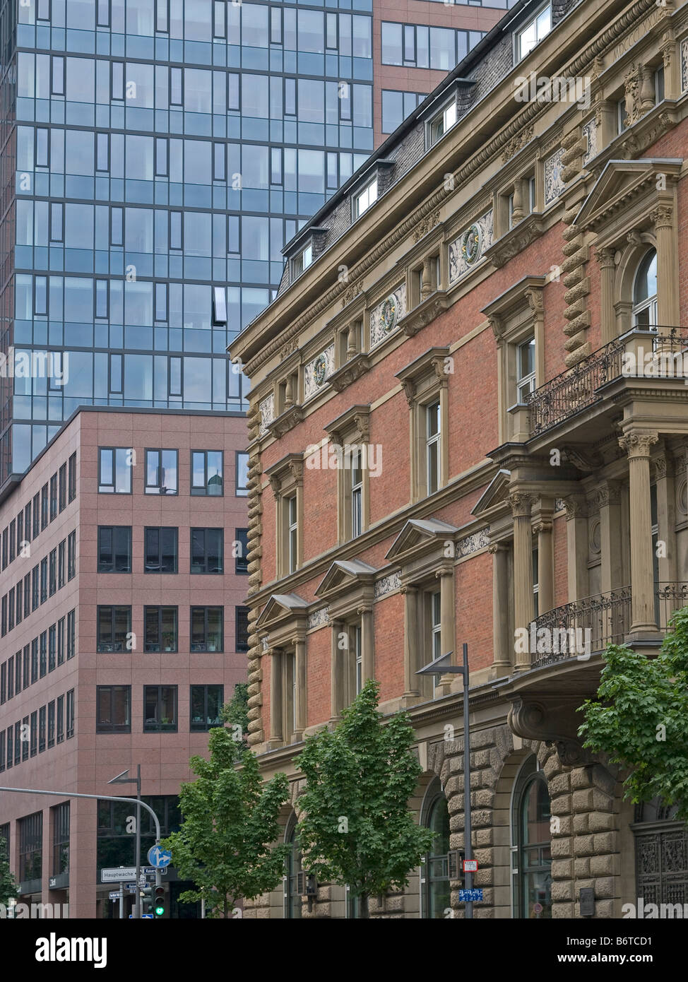 building with facade in Wilhelminian style beneath buildings in modern architecture in Frankfurt Main Germany Stock Photo