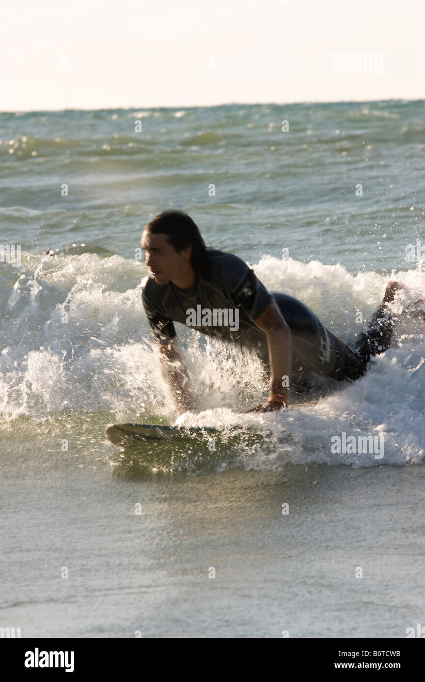 Great Lakes surfer trying to catch a wave Stock Photo