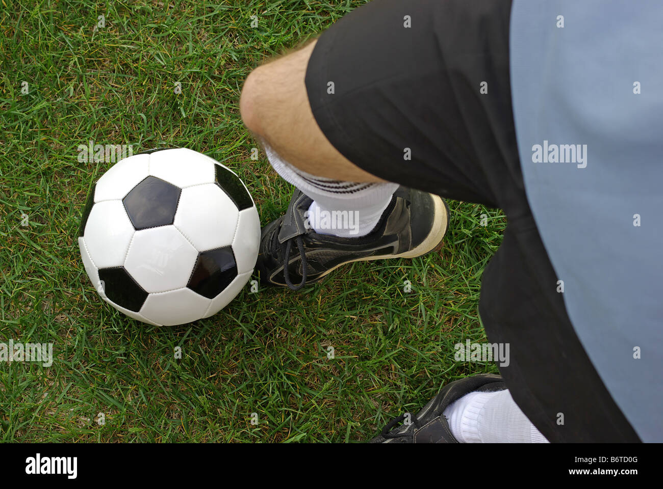 Soccer ball being kicked by player Stock Photo Alamy