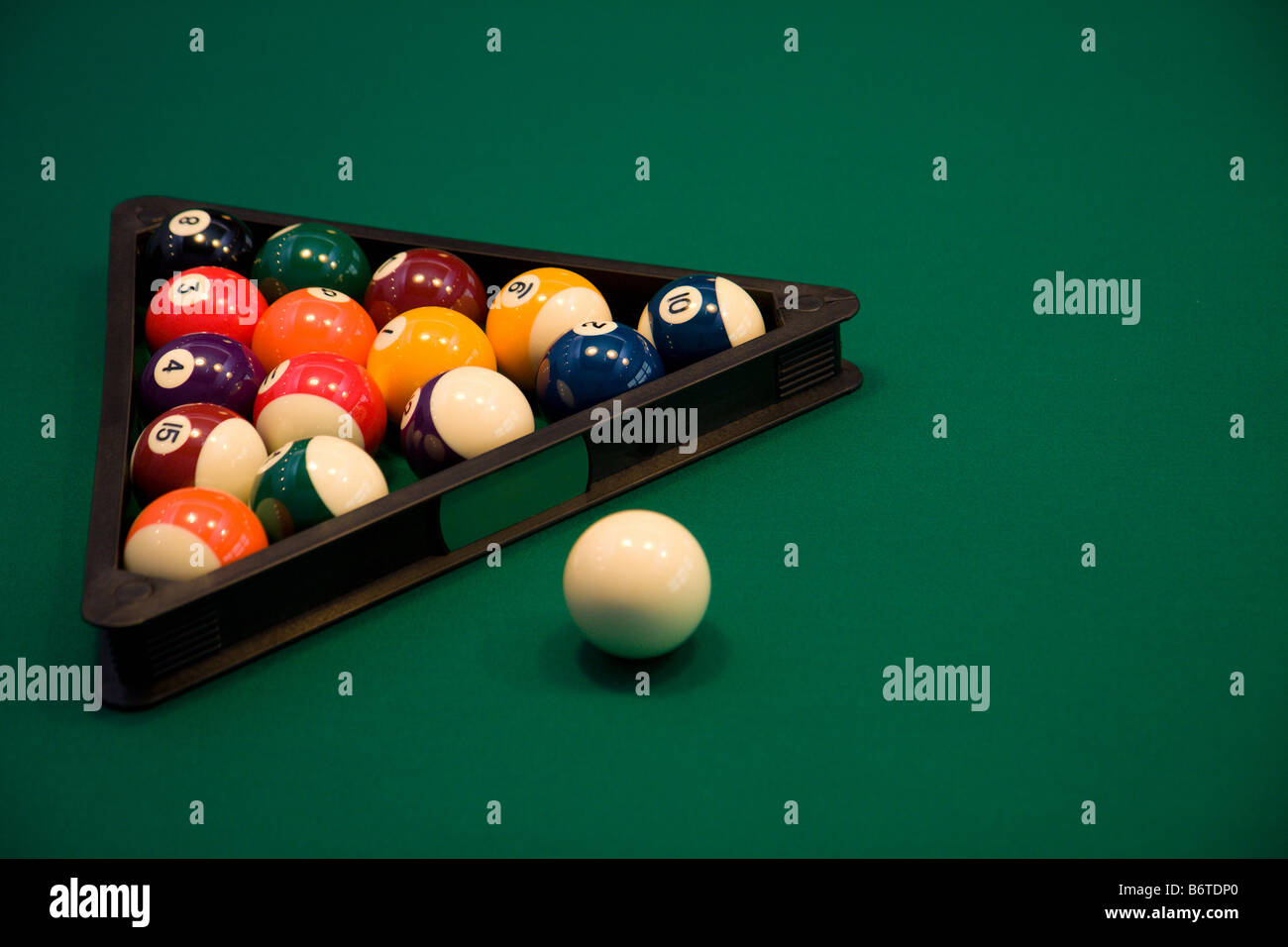 Color billiard balls on a green table in sport bar Stock Photo Alamy