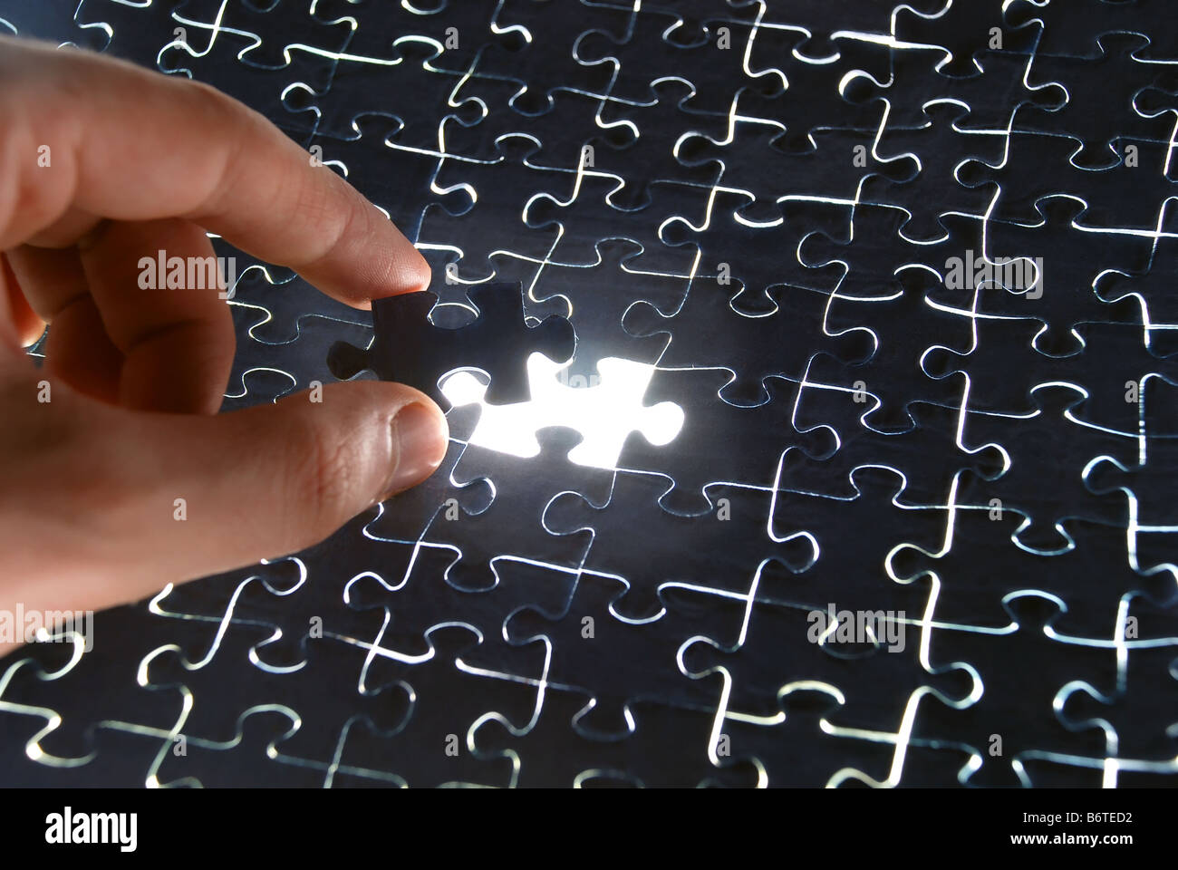 Assembling the puzzle Stock Photo Alamy