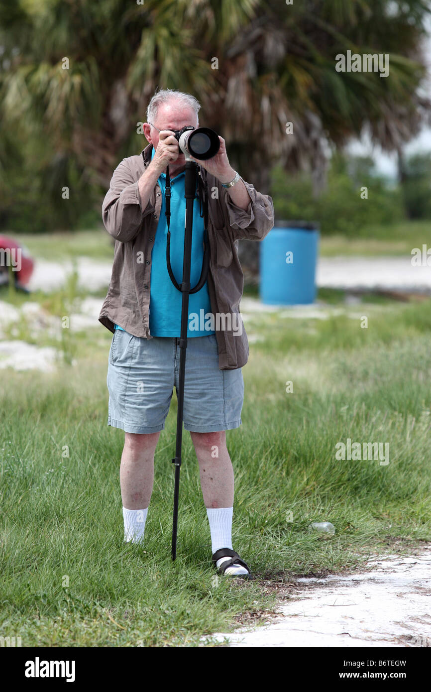 Carl Purcell shooting image with monopod and telephoto lens Stock Photo