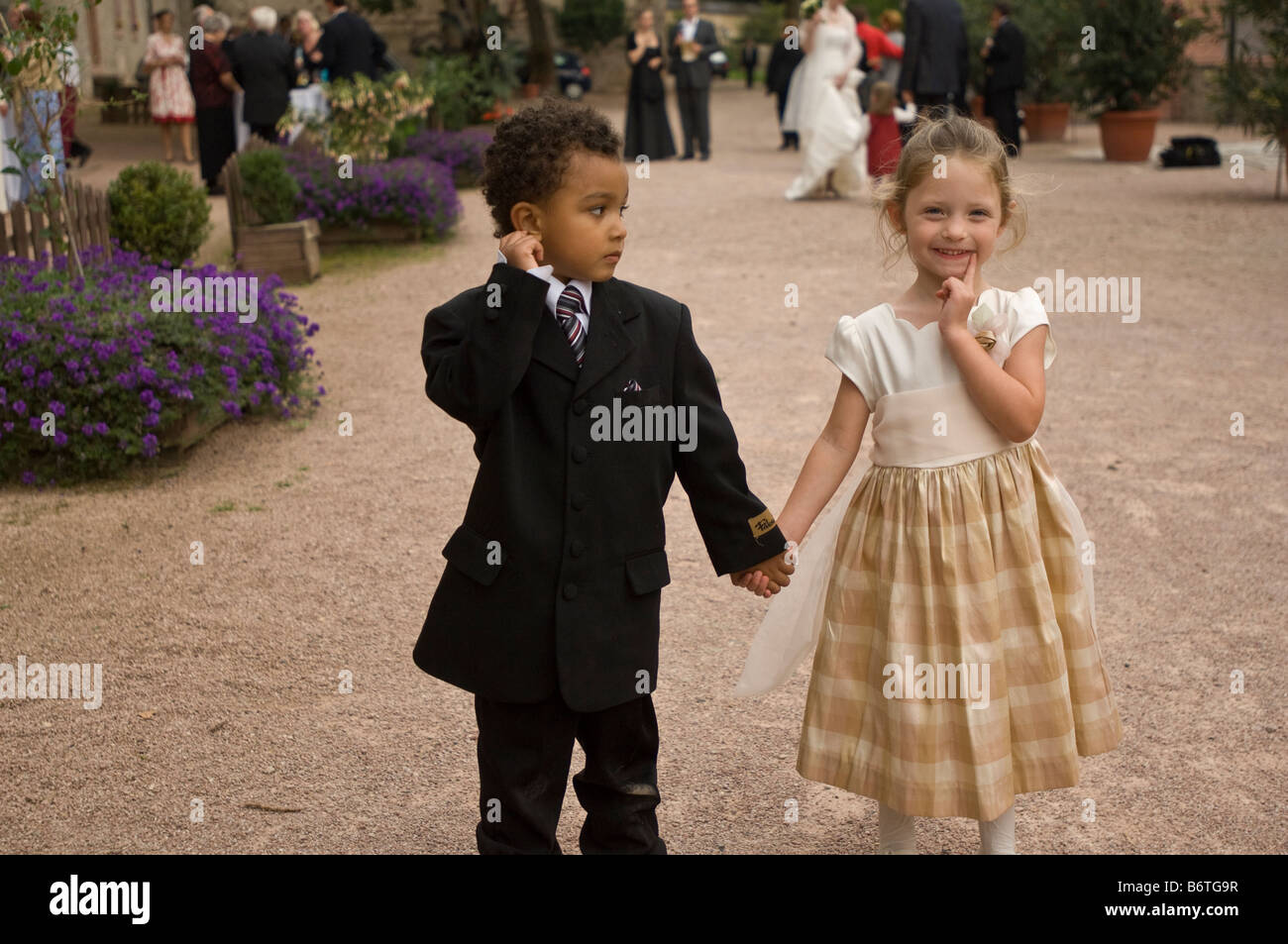 Young boy and girl holding hands Stock Photo - Alamy