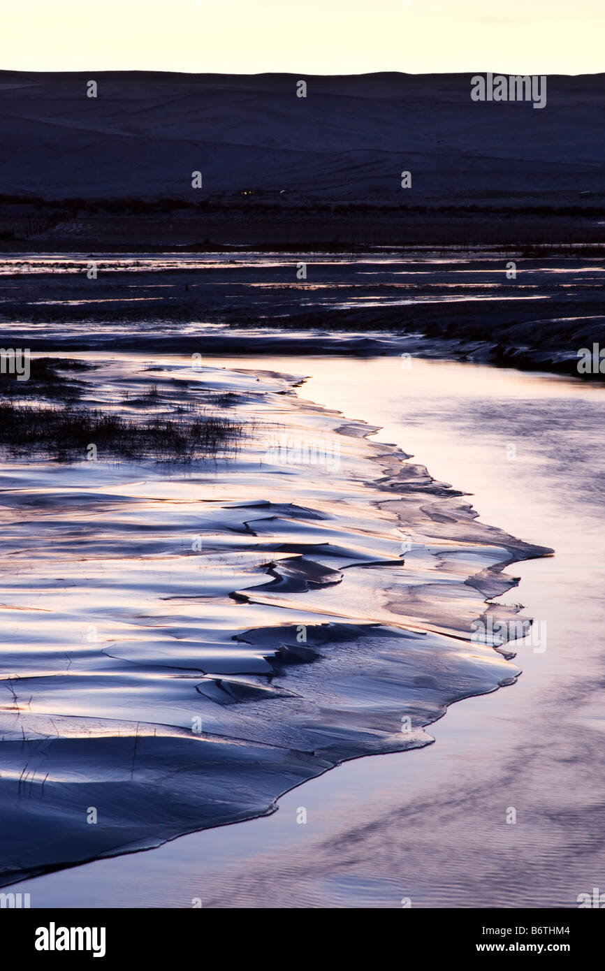 Chilly, icy landscape of the Fremont river in Utah at sunset. Stock Photo