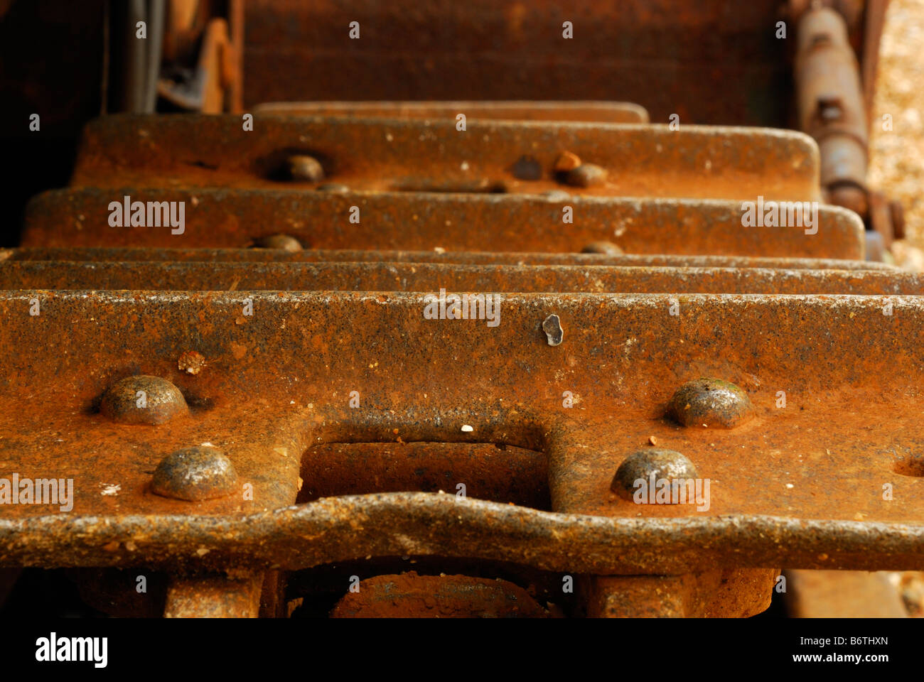 Rusty caterpillar track on abandoned bulldozer Stock Photo