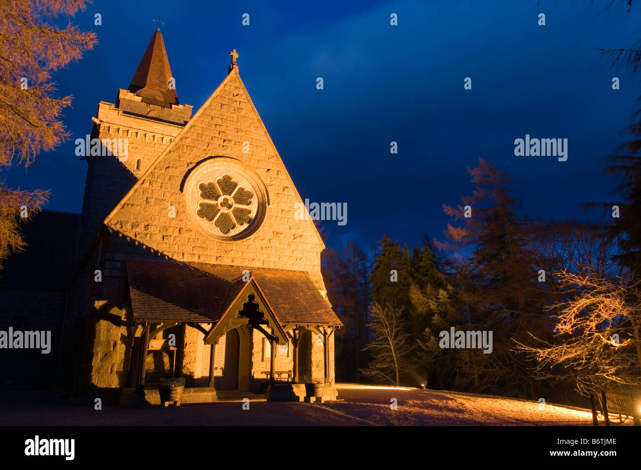 Crathie church near Balmoral in a grove of larch trees Stock Photo