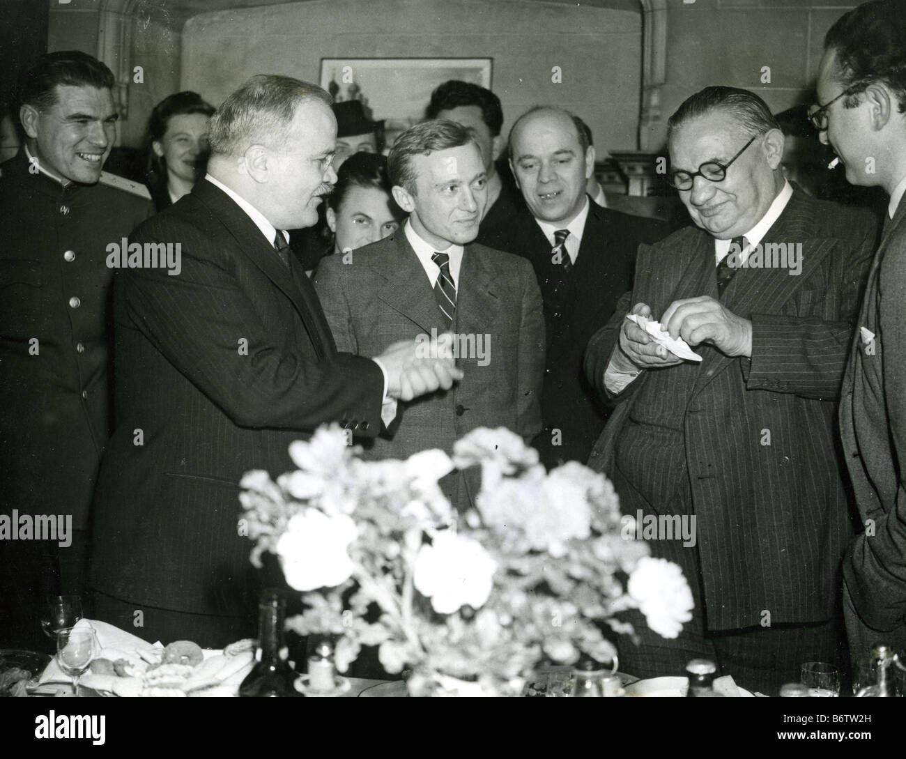 ERNEST BEVIN at right with Vyacheslav Molotov at left and translator Pavlov in centre at the Soviet Embassy in London about 1943 Stock Photo