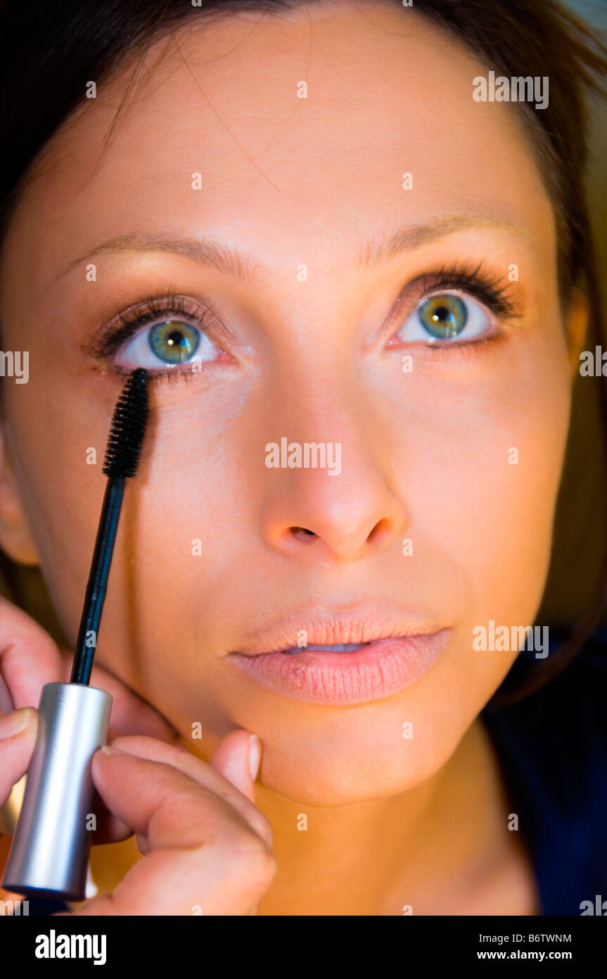Woman applying mascara. Stock Photo