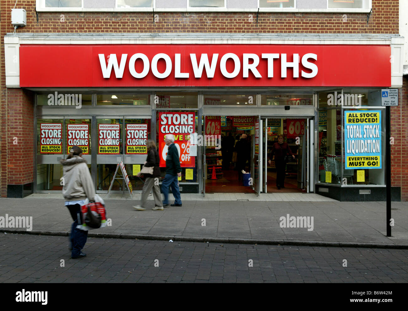 Woolworths in Sudbury Suffolk with closing down sale signs displayed in front window in landscape or horizontal farmat Stock Photo