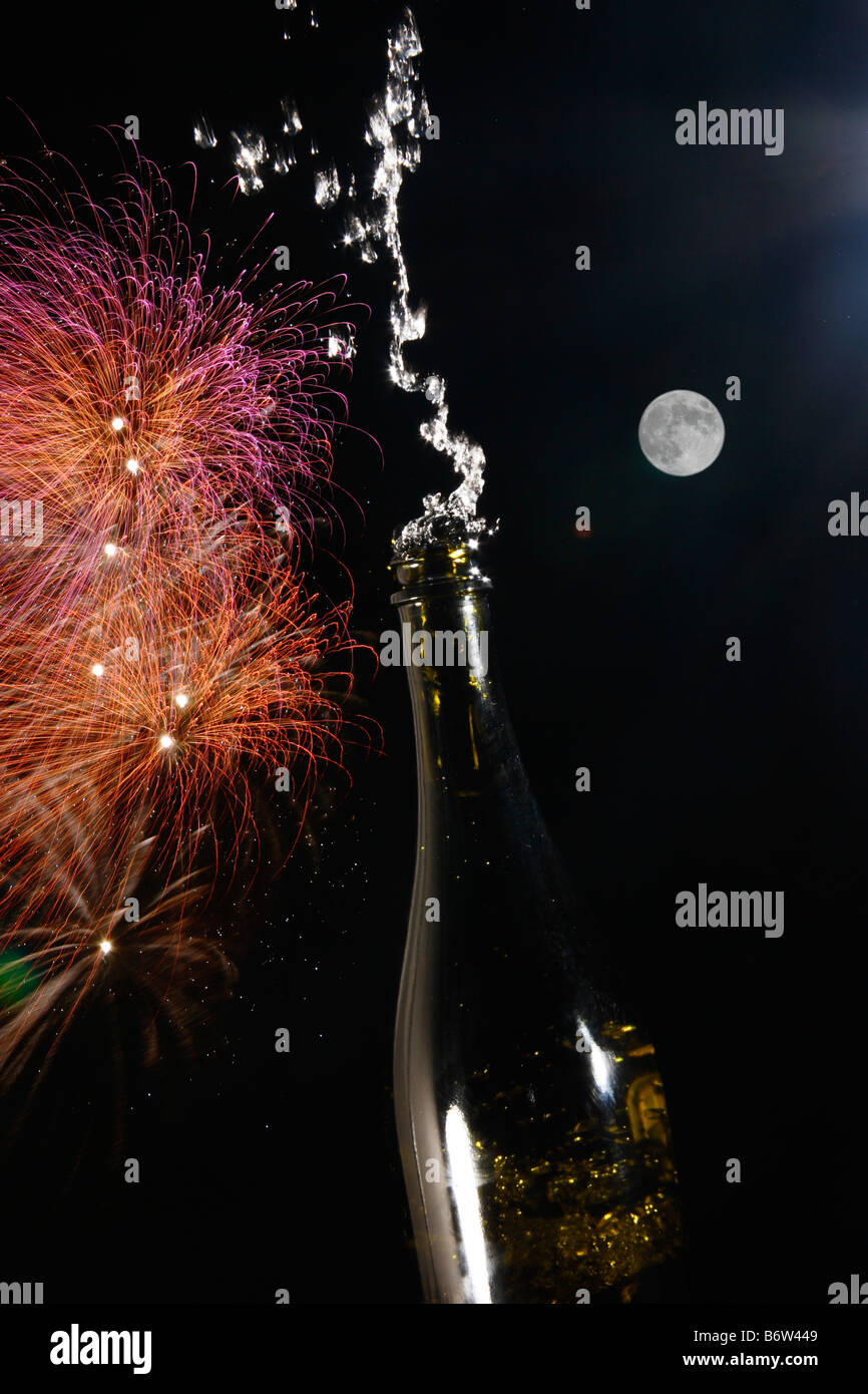 Champagne wine bottle Celebration with Fireworks at night with the moon. Stock Photo