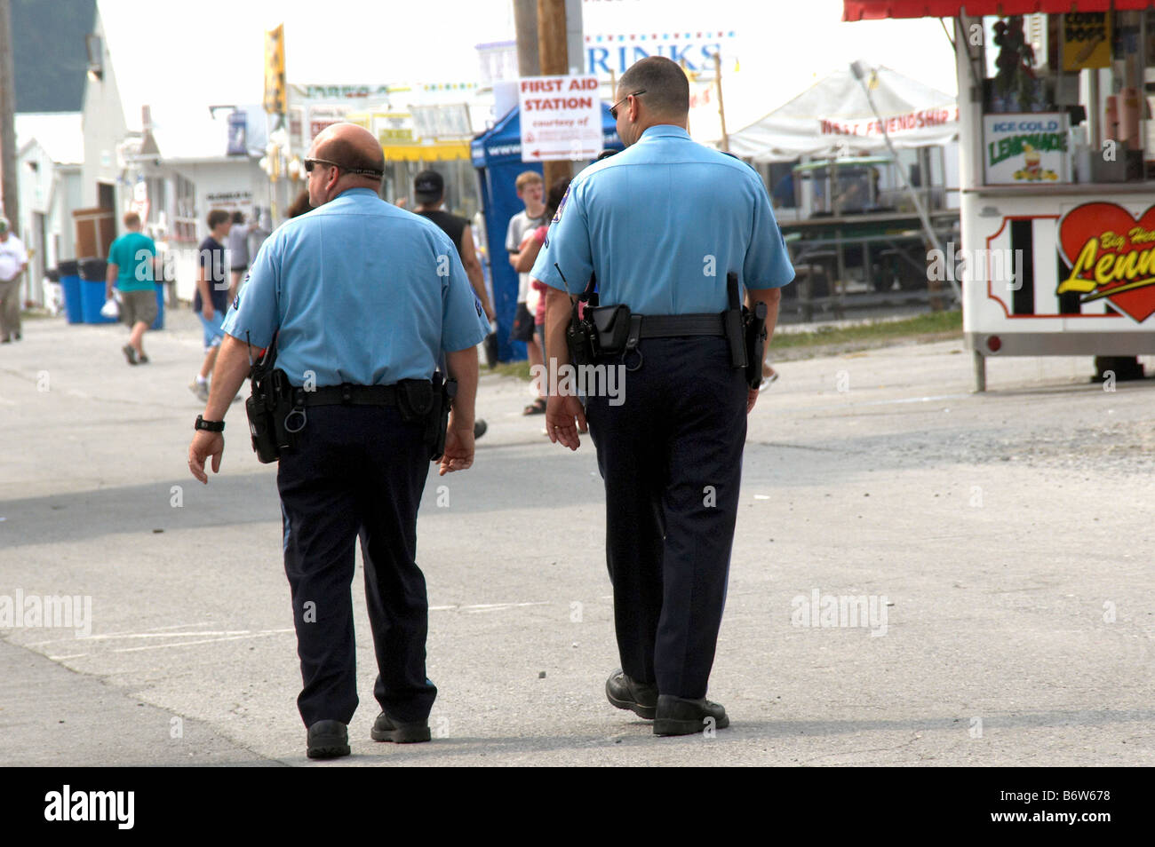 two policemen on foot patrol at the county fair in West Friendship Maryland Stock Photo