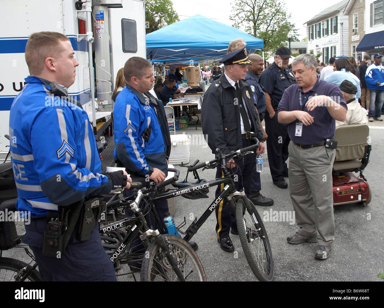 Police question a man at a festival in Laurel Maryland Stock Photo
