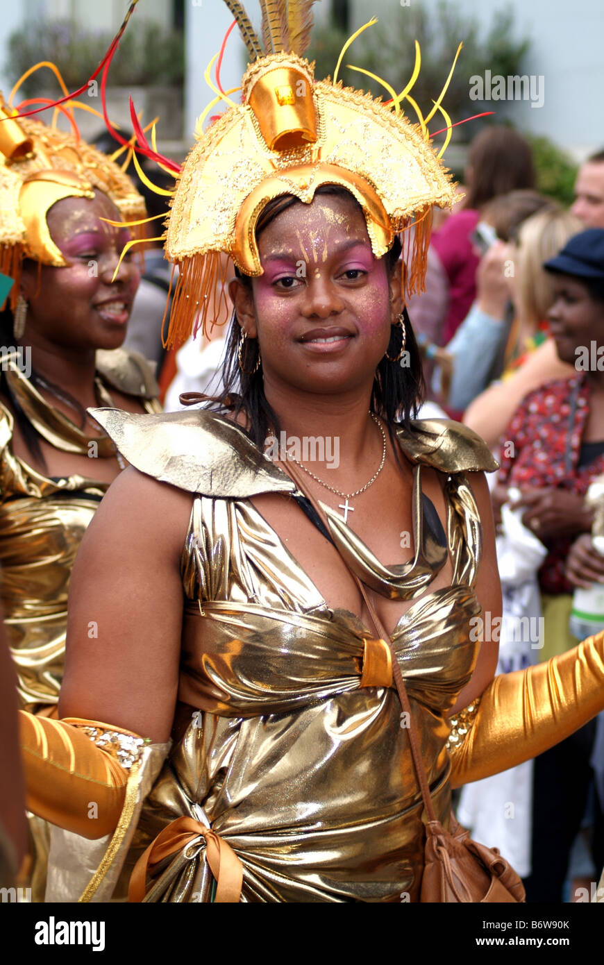 female woman black ethnic caribbean dancer smiling notting hill carnival festival street theatre london england uk europe Stock Photo