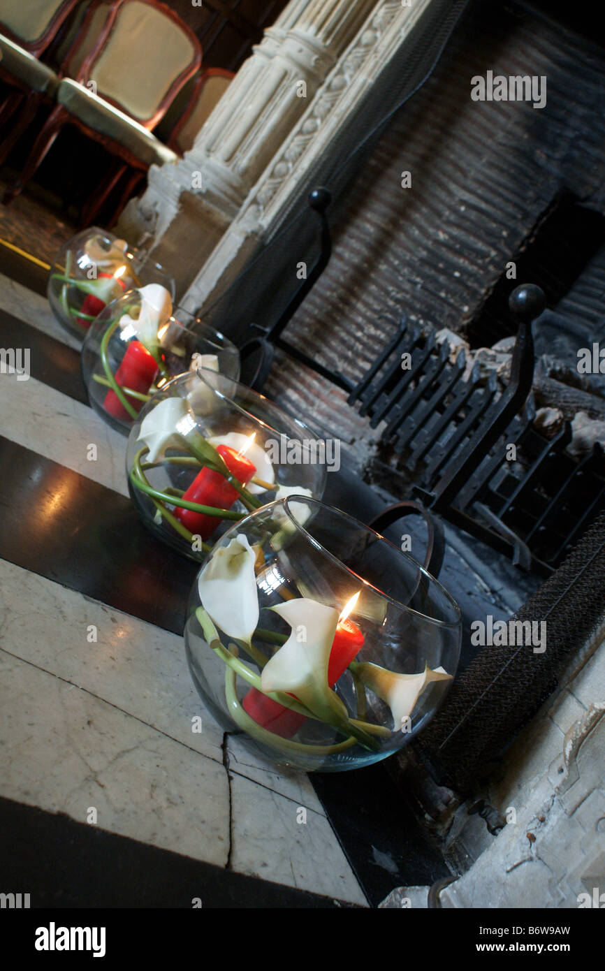 Fish Bowl Vases With Candles Inside In Old Fireplace Stock Photo
