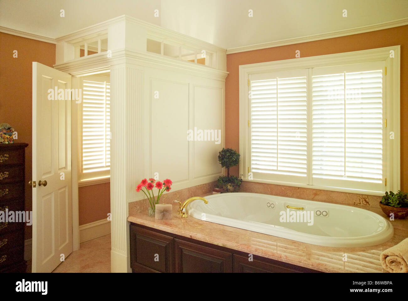 Detail traditional bathroom with marble around Jacuzzi tub Stock Photo
