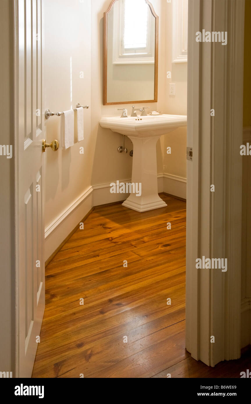 View into small bathroom with pedestal sink Stock Photo Alamy