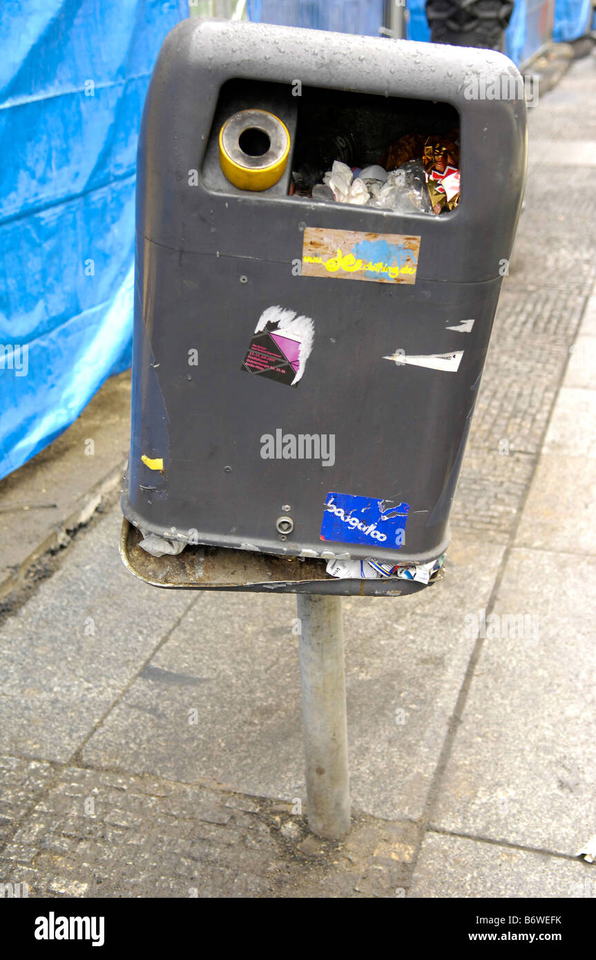 rubbish bin waste disposal berlin germany deutschland sticker art graffiti real Stock Photo