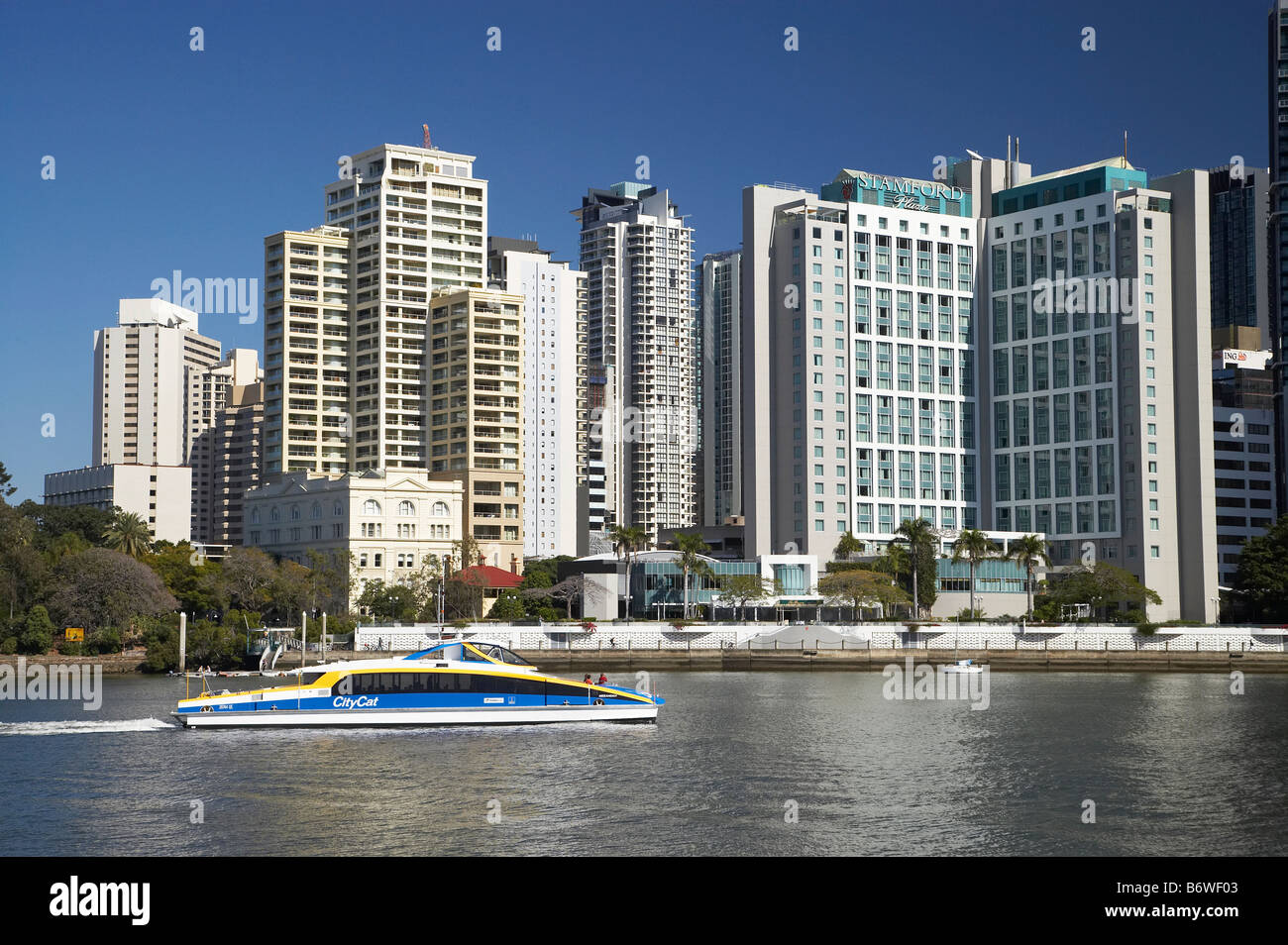 Stamford Plaza Hotel and Skyscrapers and City Cat Passenger Ferry Brisbane River Brisbane Queensland Australia Stock Photo