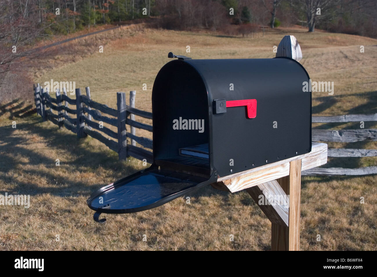 Rural mailbox open with mail inside Stock Photo