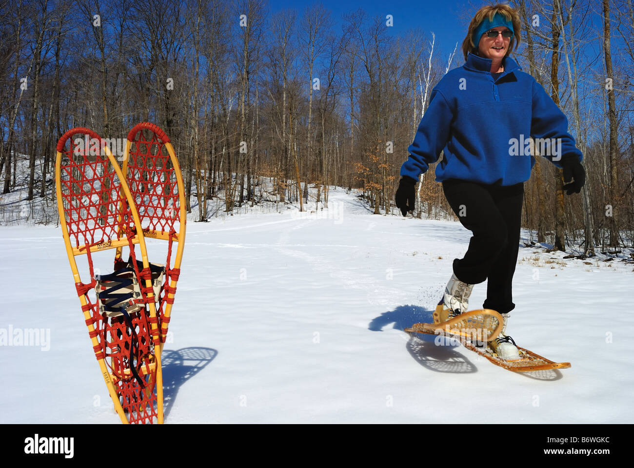 Woman snowshoing in winter Stock Photo