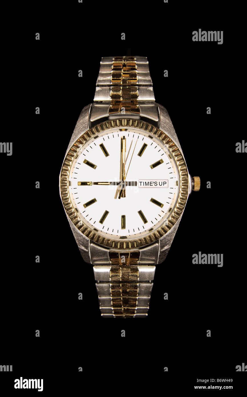 A man s watch with the words Time's Up in place of the time on a black background in portrait orientation. Stock Photo