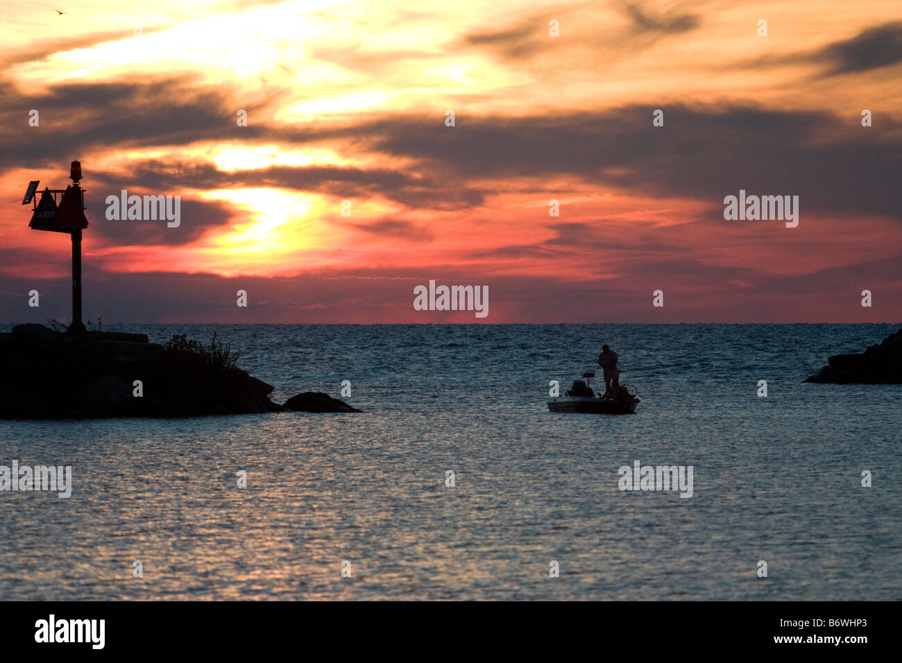 Lone fishing boat at entrance to harbor at New Buffalo Michigan at
