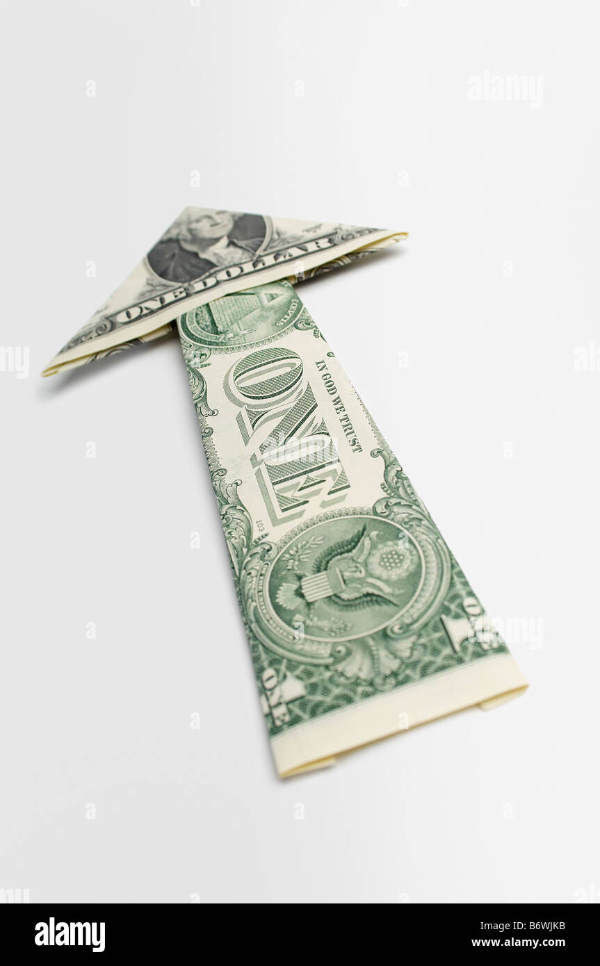 Arrow Made of Money Stock Photo