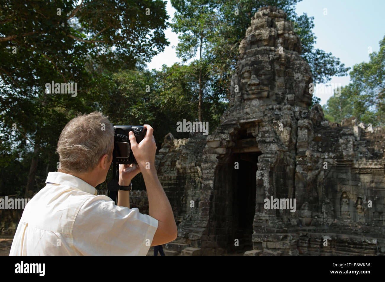 Man Photographing Ancient Temple Stock Photo