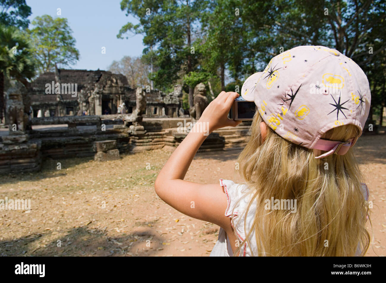 Little Girl Photographing Ancient Temple Stock Photo